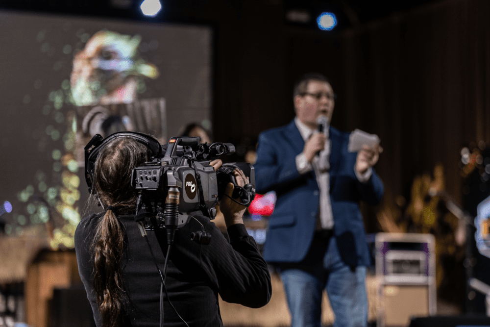 Camera Operator Live Streaming an Event